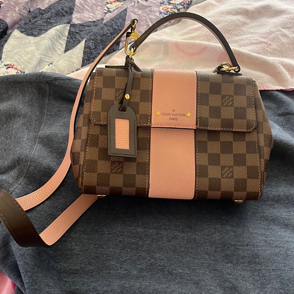 Louis Vuitton handbag .